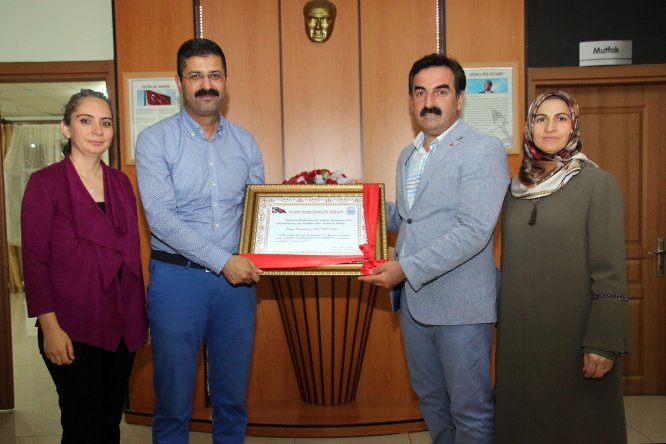 Kaymakam Pektaş'a "Fahri Hemşehrilik Beratı"